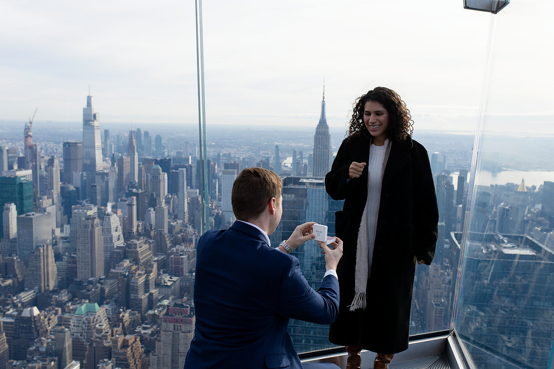 Engagement photo with NYC skyline and Empire State Building in the background — NYC engagement photographer Kali Artistry